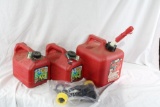 One 2 gal plastic gas can with spout and two 1 gal plastic cans with spouts. Like new.