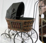 One decorative antique style baby doll carriage. In very nice condition.