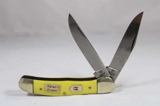 Kissing Crane two blade folder with 3.0 inch blades, synthetic yellow scales. Appears unused. Made