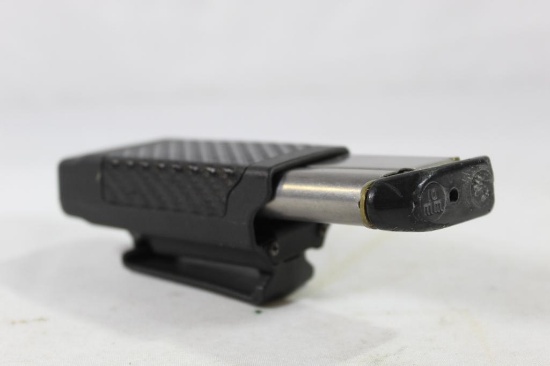 One Colt 10mm 1911 style magazine with BlackHawk belt/pant clip-on holder.