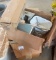Two small plastic bins of screws, washers and other miscellaneous items