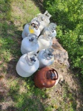 9 propane bottles, some with propane