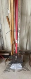 Various yard tools including leaf rake, shovels, hoe and 3 tine cutlivator