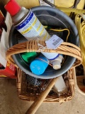 Basket of miscellaneous items including hammer, wd40, bug spray, window cleaner etc.