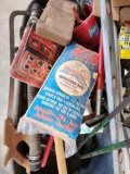 Tub of miscellaneous tools, bow saw, shop towels, squeegee, hoses ect.