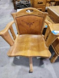 Wooden rolling chair with leather insert