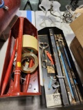 Two metal tool caddies with misc tools and tape