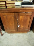 Wooden cabinet with file shelves inside.30