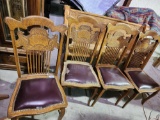 4 wood dinner chairs with leather seats