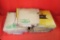 Large stack of John deere manuals for combines, tractors, lawn mowers etc