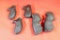 Five hard rubber and plastic pistol grips. One Pachmayr, two Hogue monogrip. Used.