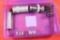 Purple plastic box with miscellaneous springs and reloading items.