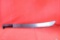 Large Machete with 22 inch blade, black plastic handle. Blade is marked 