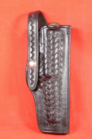 Safariland #79 black tooled leather right handed snap holster for 9mm Luger. Like new.