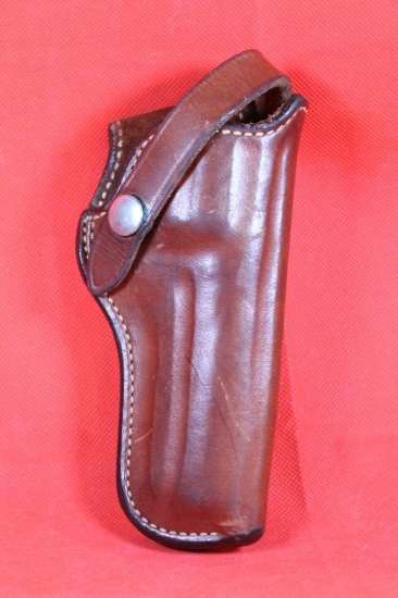 Bianchi brown leather right handed snap holster for small revolver. Used in good condition.