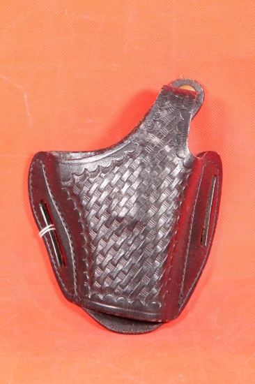 S&W black tooled leather right handed belt snap holster. Used in very nice condition.