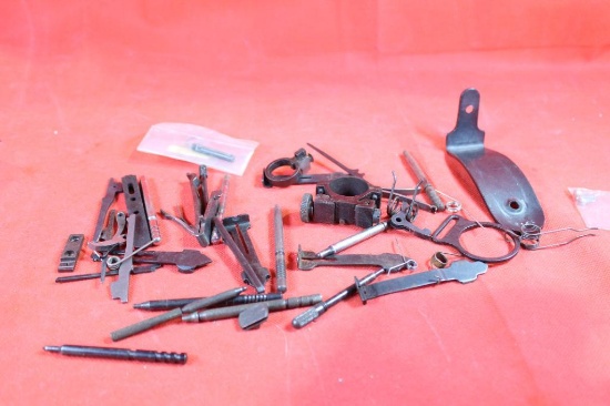 Bag of miscellaneous gun parts and firing pins.