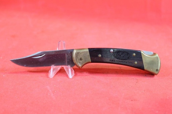 Buck Model 112 single blade lockback folder with 3.0 inch blade. Brass handle with wood scales. Has