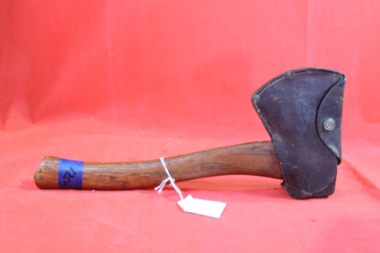 Boy Scout hatchet with leather cover. Used.