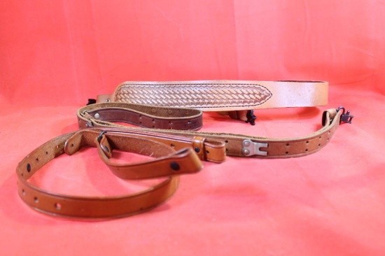 Three leather rifle slings.