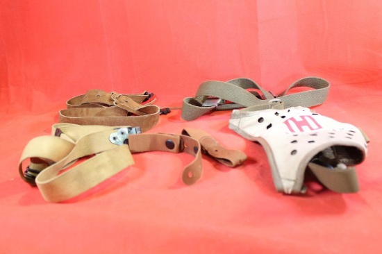 Four leather and canvas rifle slings also one Hornady backpack sling harness. Used.