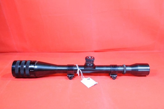 Weaver T-16 x40 rifle scope with very fine crosshairs and dot, with parallax and target turrets. Has