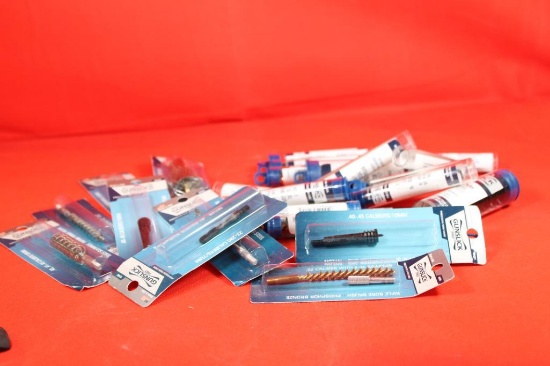 Bag of miscellaneous shotgun and rifle cleaning brushes. New in packages.