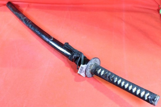 Samurai style sword with 28.5 inch blade, cord wrapped handle and wooden sheath.