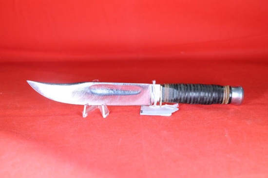 Sheath knife with 6.0 inch blade, stacked leather washer handle. Blade has deep pitting but has been