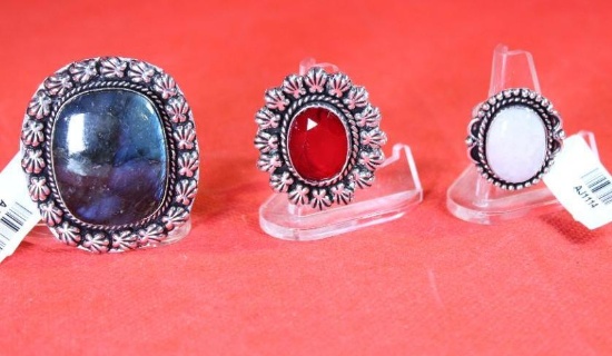 Three German silver rings. One size 6 with a red garnet, one size 7 with a rainbow moonstone and one