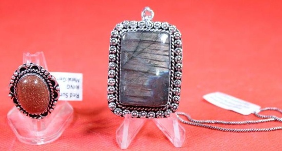 One German silver ring size 7 with a red sun stone and one german silver necklace with chain and a