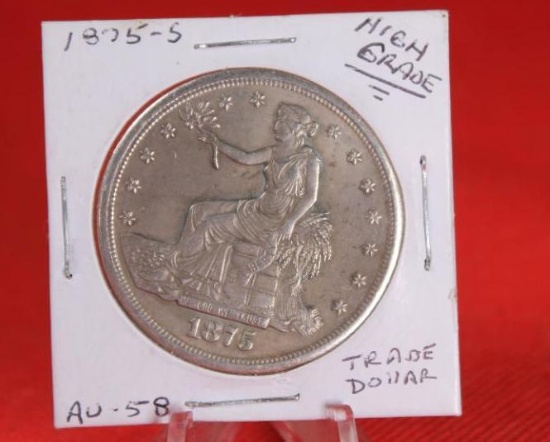 1875-S Trade silver dollar. Reproduction. Wt. 23g should be 27.2g.