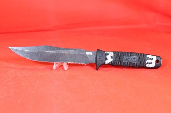 SOG Seal Team fixed 7" blade with hard plastic sheath. Used, in nice condition.