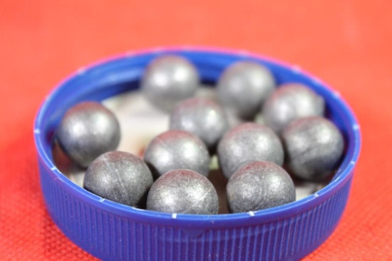Container of 54 Cal round lead bullets for muzzleloader. Approx cnt 100