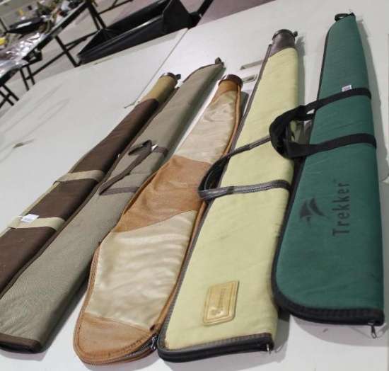 Five soft sided zippered rifle cases. Four are lined and padded, one is just lined. Used, but in