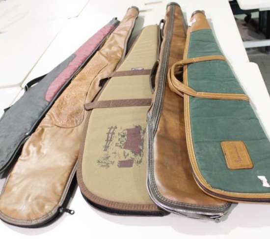 Five soft sided zippered rifle cases. Three are lined and padded, two are just lined. Used in very