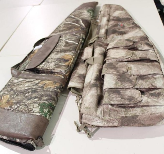 Two camo soft sided zippered and padded scoped rifle cases. Like new.