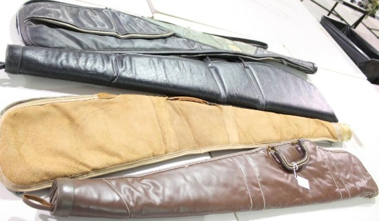 Four soft sided zippered rifle cases. Two lined and padded and two are lined. Used in very good