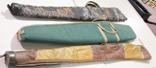 Three soft sided zippered rifle cases. One lined and padded and two lined. Like new.