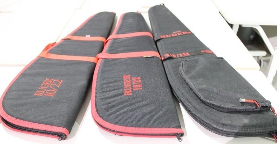 Three soft sided padded, zippered Ruger rifle cases. New.