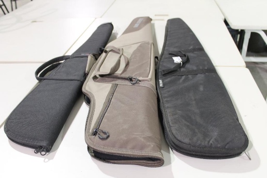 Three soft sided lined and padded zippered rifle case. Two are for scoped rifles. New.