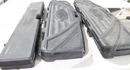 Three hard black plastic cases. One single rifle case and two bow cases. Like new.