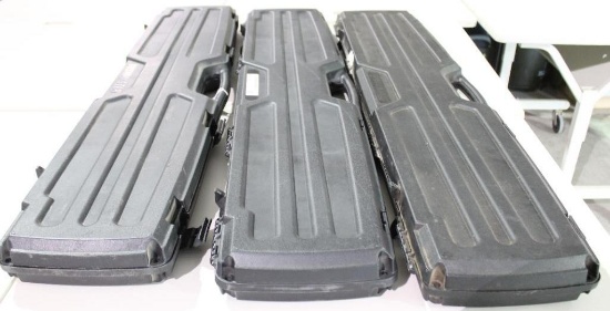 Three hard black plastic rifle cases. Like new.