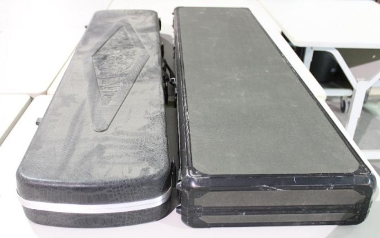 Two Two hard side double rifle case. One hard black plastic and one nylon covered aluminium. new.