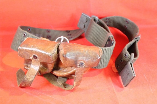 Green web belt with a double leather ammo pouch.
