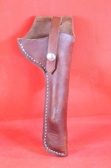 Brown leather right hand 4" pistol holster. Used in very good condition. Looks to be for a heavy