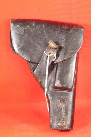 Black leather right handed P38 holster with magazine holder. Used.