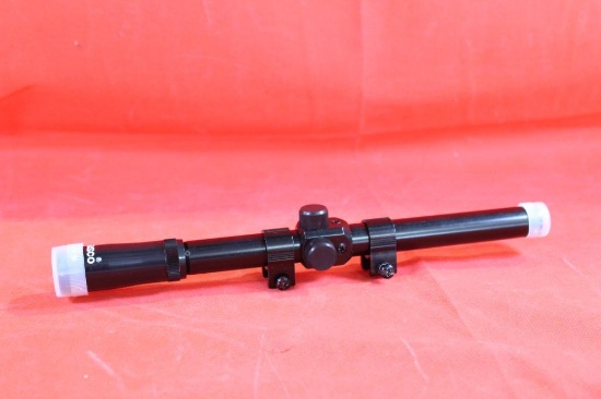 Tasco 22 rifle scope with rail mount rings and scope covers. New in box.