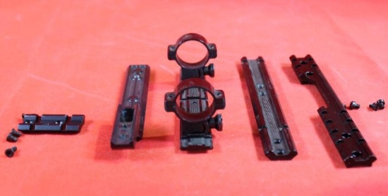 Four picatinny rails and one set of rings. Like new.
