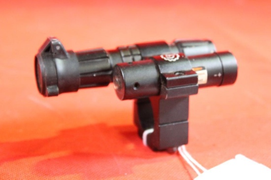 Under barrel ring with flashlight and laser. Looks new.